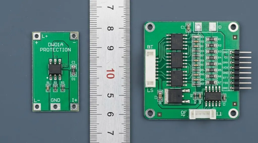 simple lithium ion battery protection circuit board compared side by side with full BMS protection board